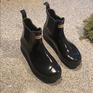 Patent Chelsea rain boots.